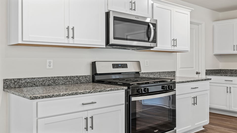 Kitchen with island and countertops.