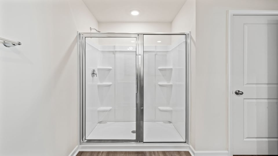 Bathroom with walk in shower.