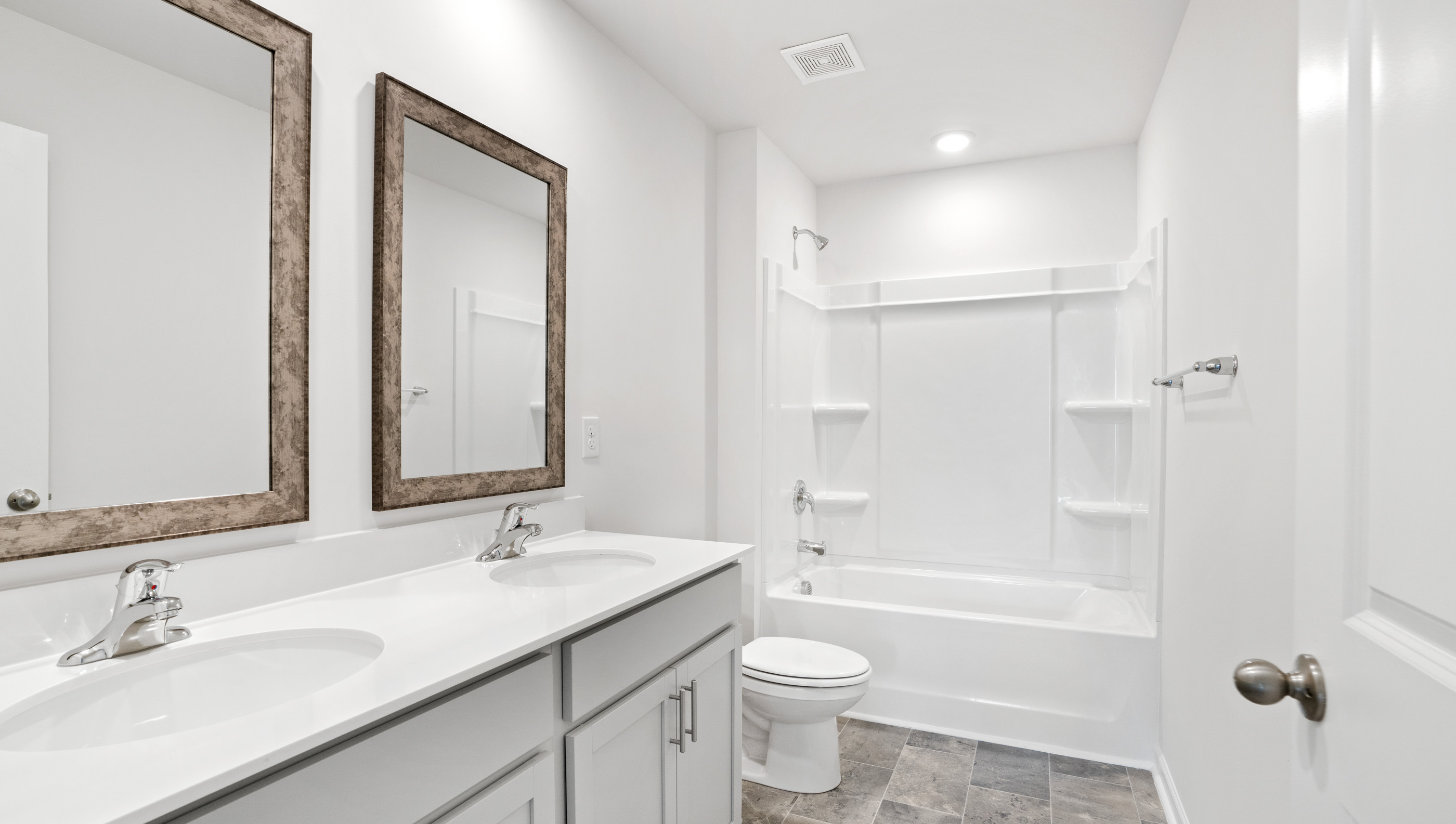 Bathroom with vanity and tub.