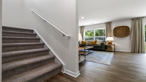 Hallway with view of stairs.