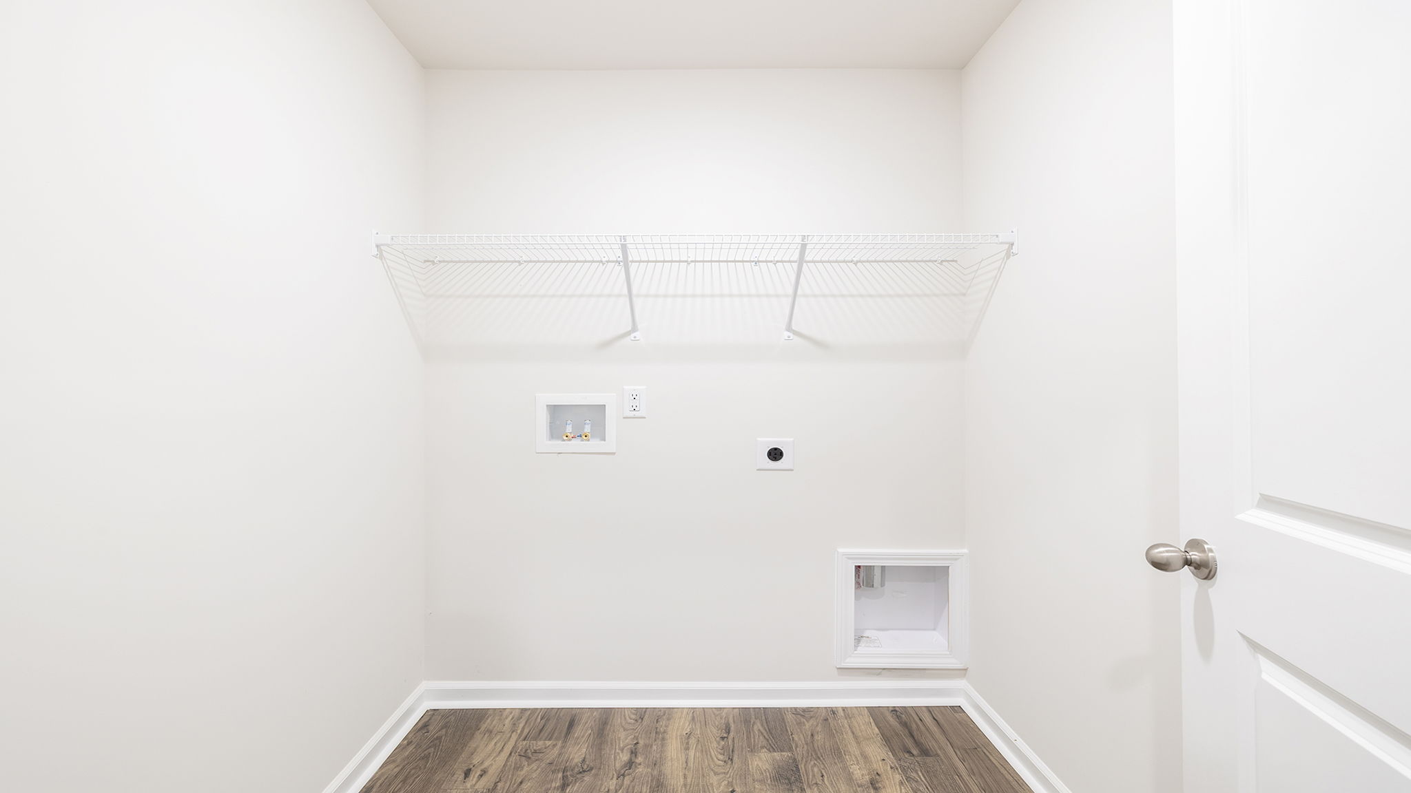 Walk in laundry with shelves.