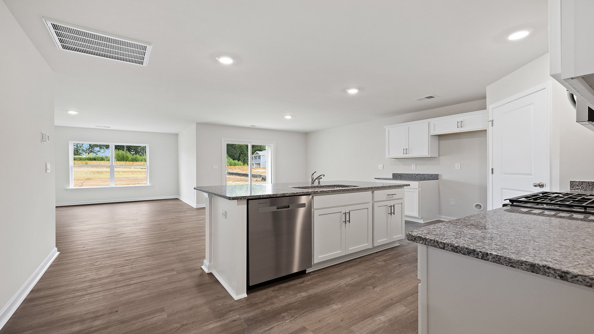 Kitchen with island and stainless steel appliances.