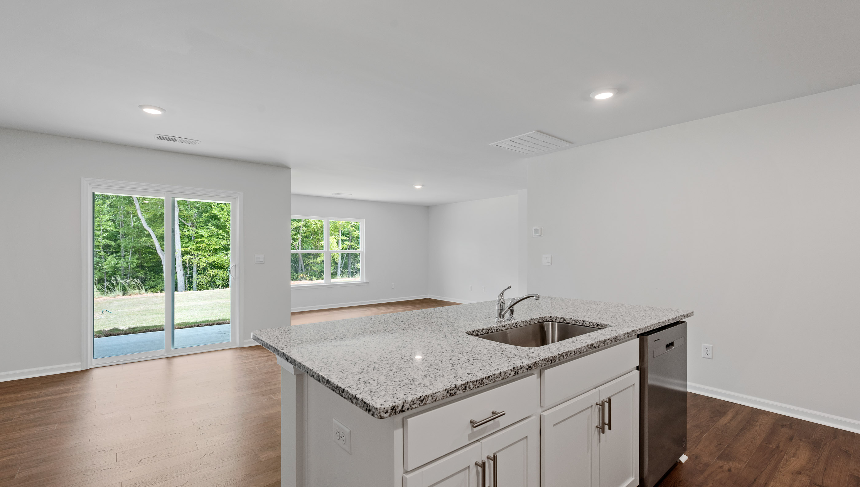 Kitchen and island with granite countertops.