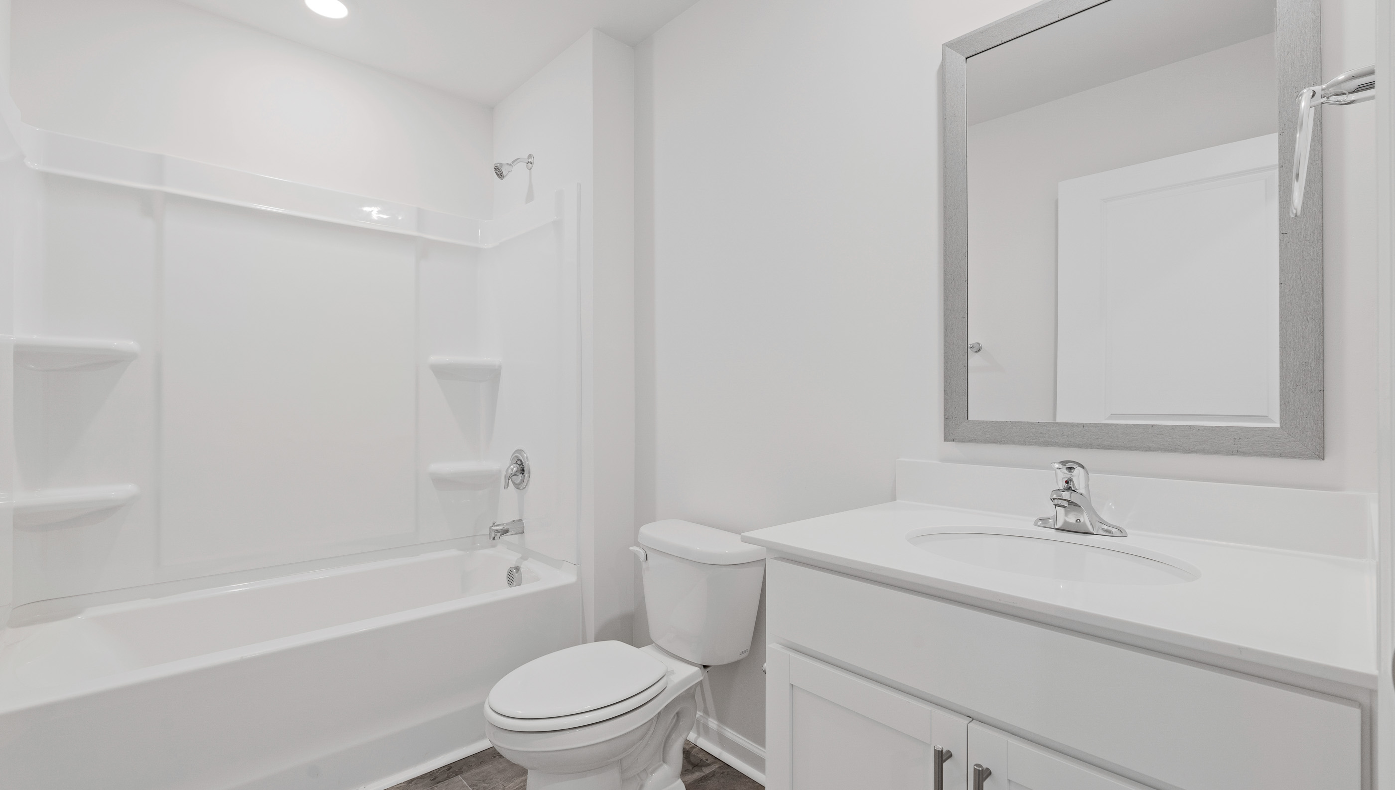 Bathroom with vanity and tub.