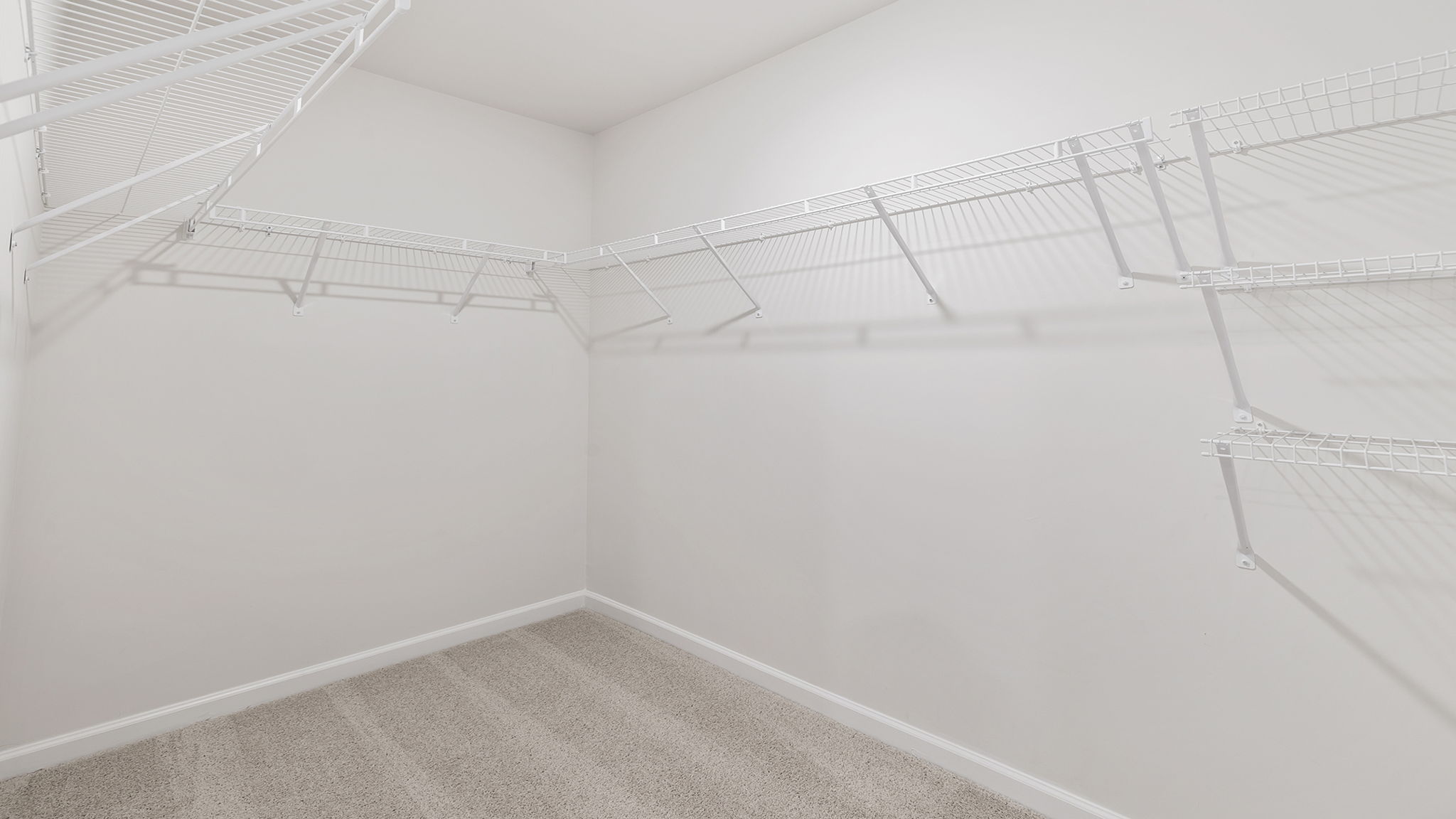 Laundry room with hanging storage rack.