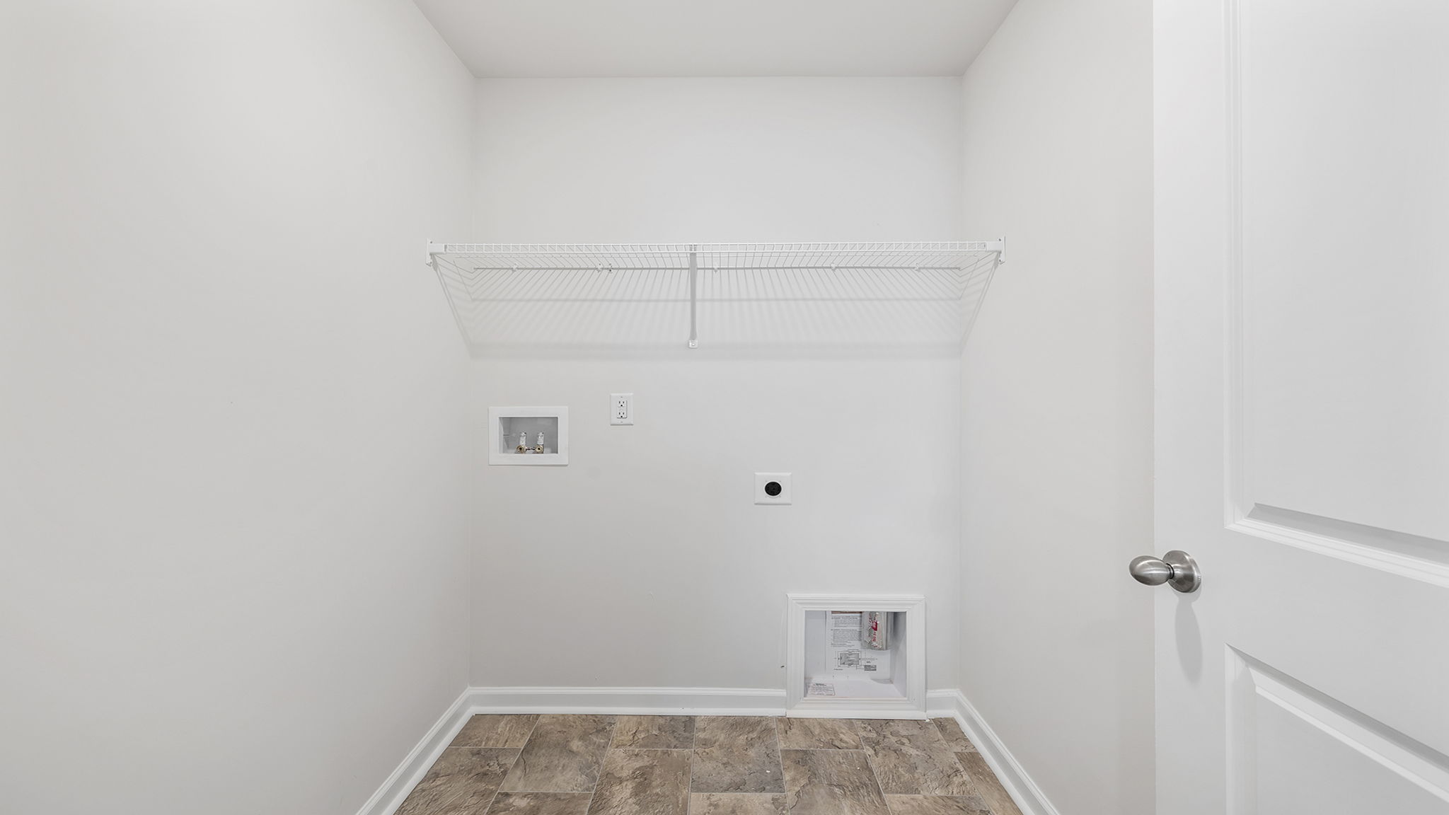 Laundry room with hanging storage rack.