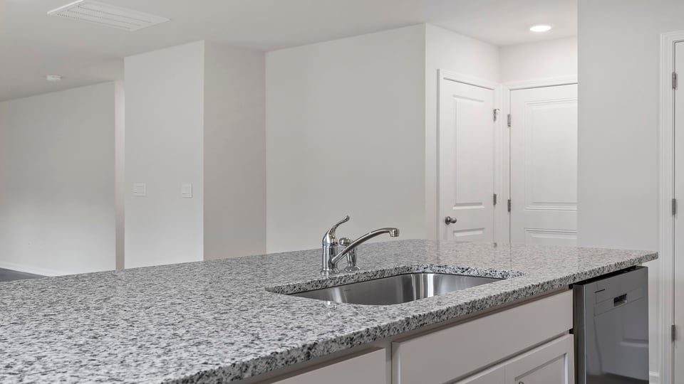 Kitchen with granite countertops.
