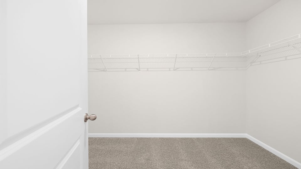 Wak in closet with shelves.