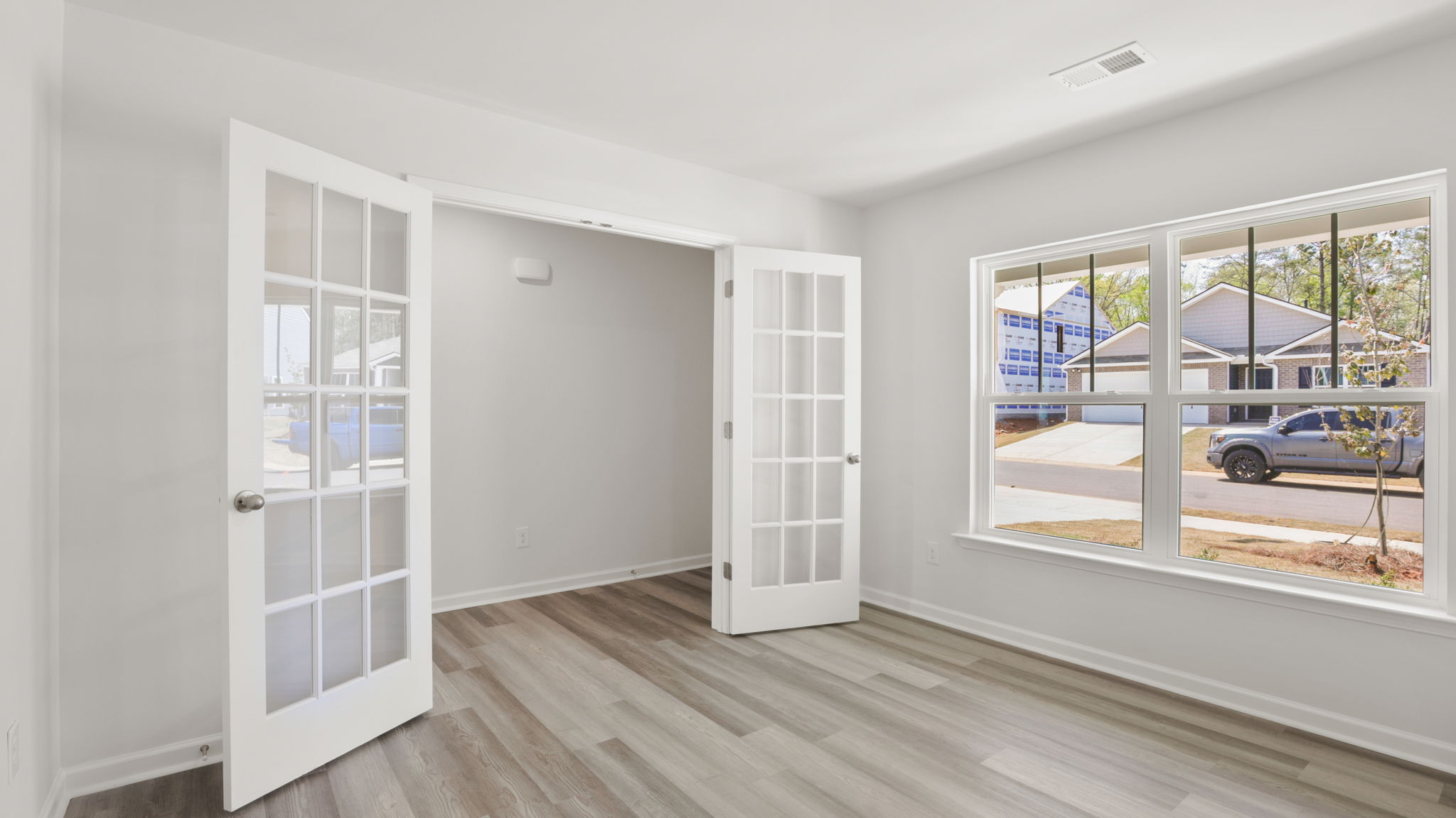 Flex room with doors that swing open.