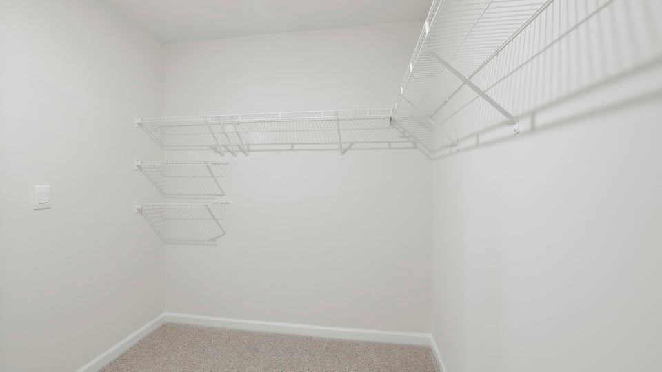 Closet with hanging storage racks.