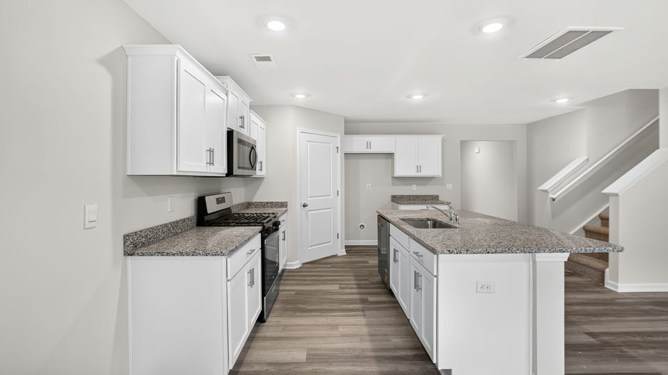 Kitchen with stainless steel appliances.