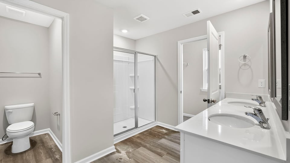 Bathroom with walk in shower and closet.