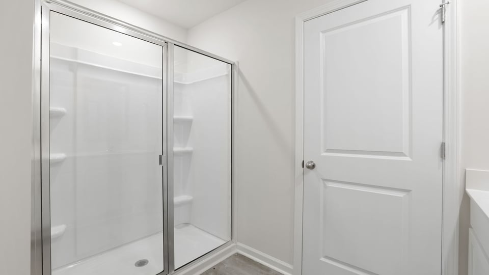 Bathroom with walk in shower.