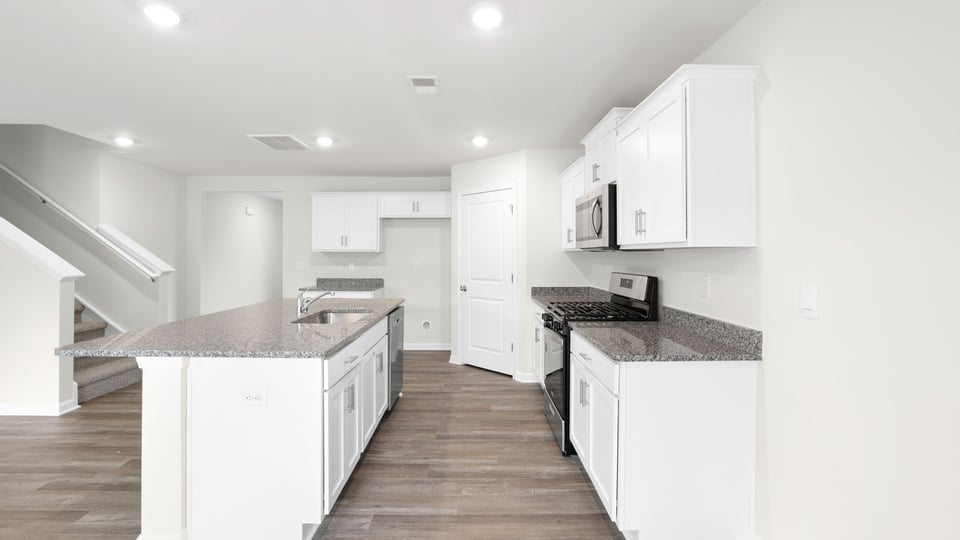 Kitchen with stainless steel appliances.