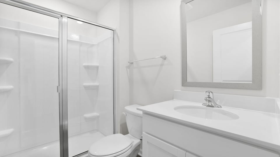Bathroom with walk in shower.