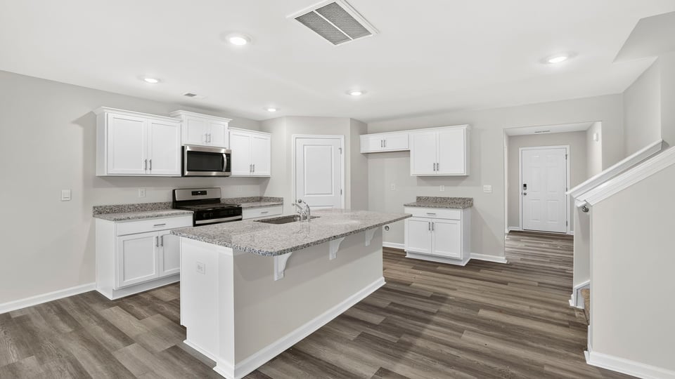 Kitchen island and quartz countertops.