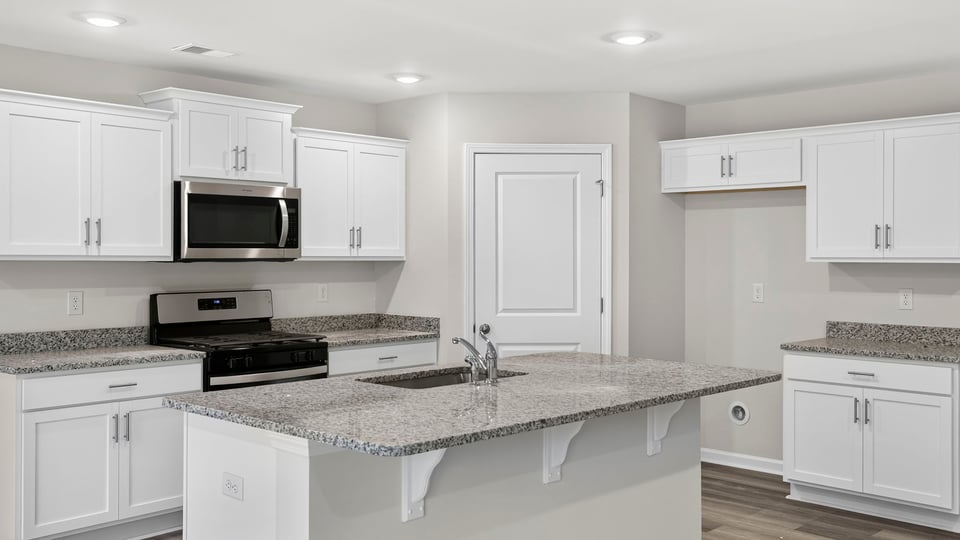 Kitchen island and quartz countertops.