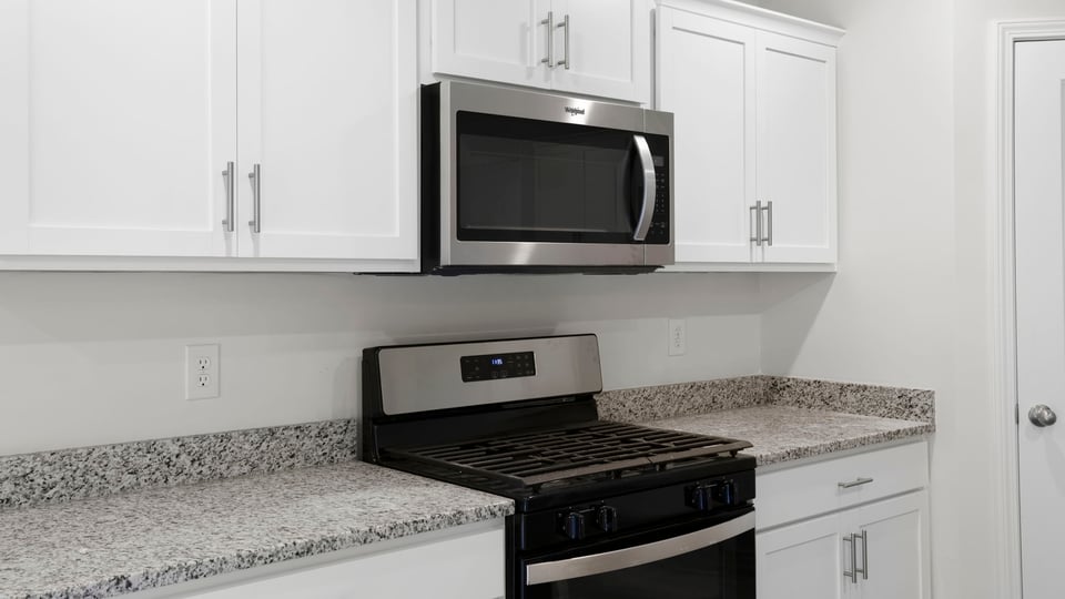 Kitchen island and quartz countertops.