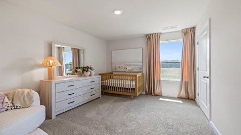 Bedroom with carpet and window