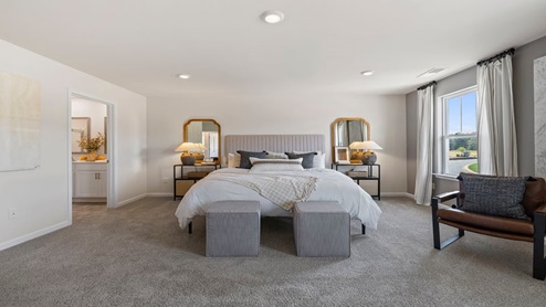 Bedroom with carpet and window