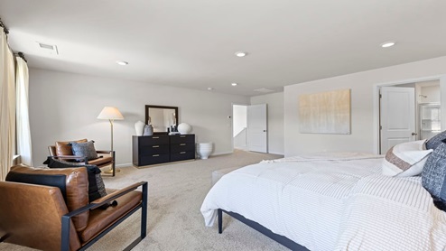 Bedroom with carpet and window