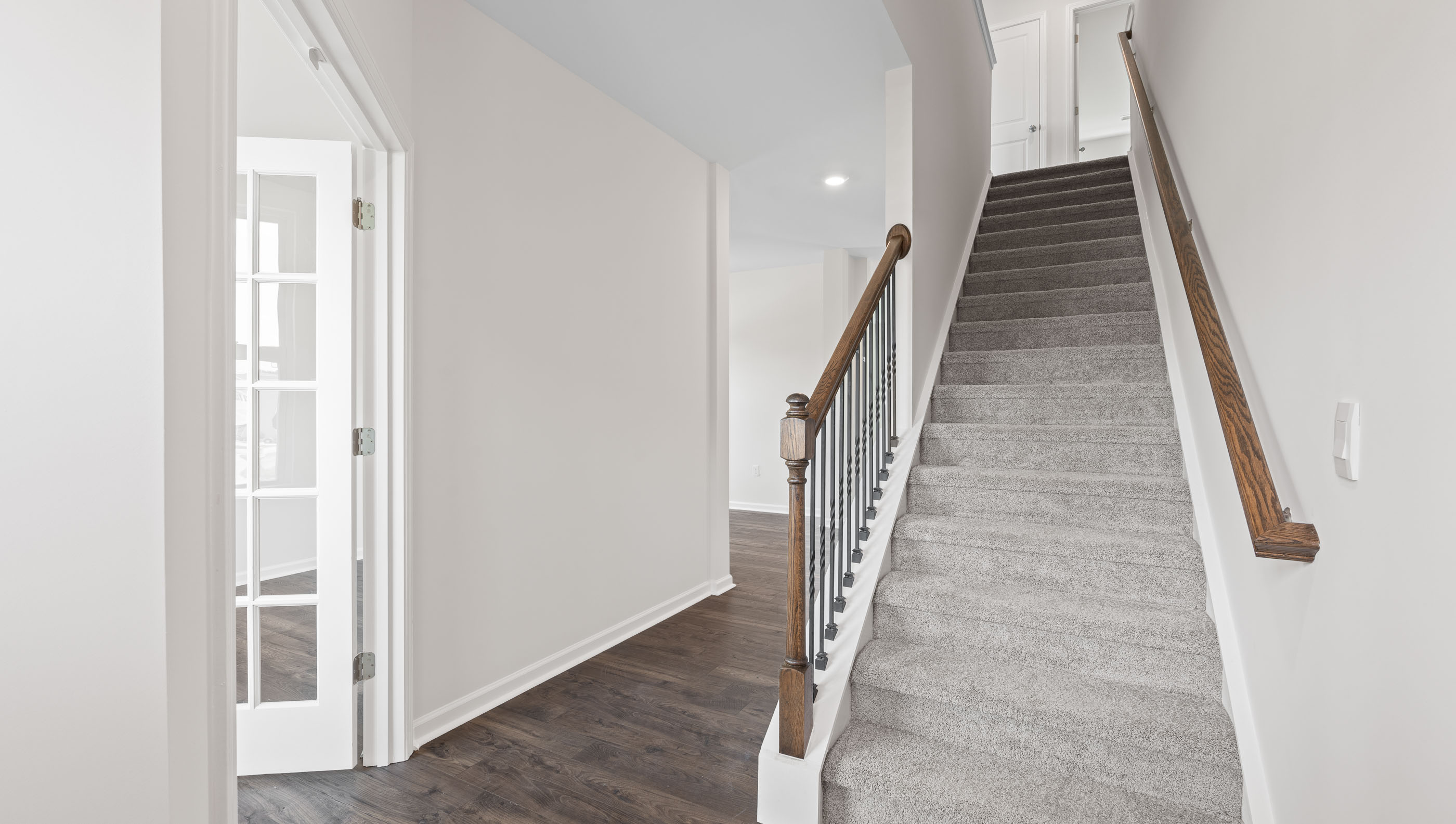 Entry way into home with view of stairs.