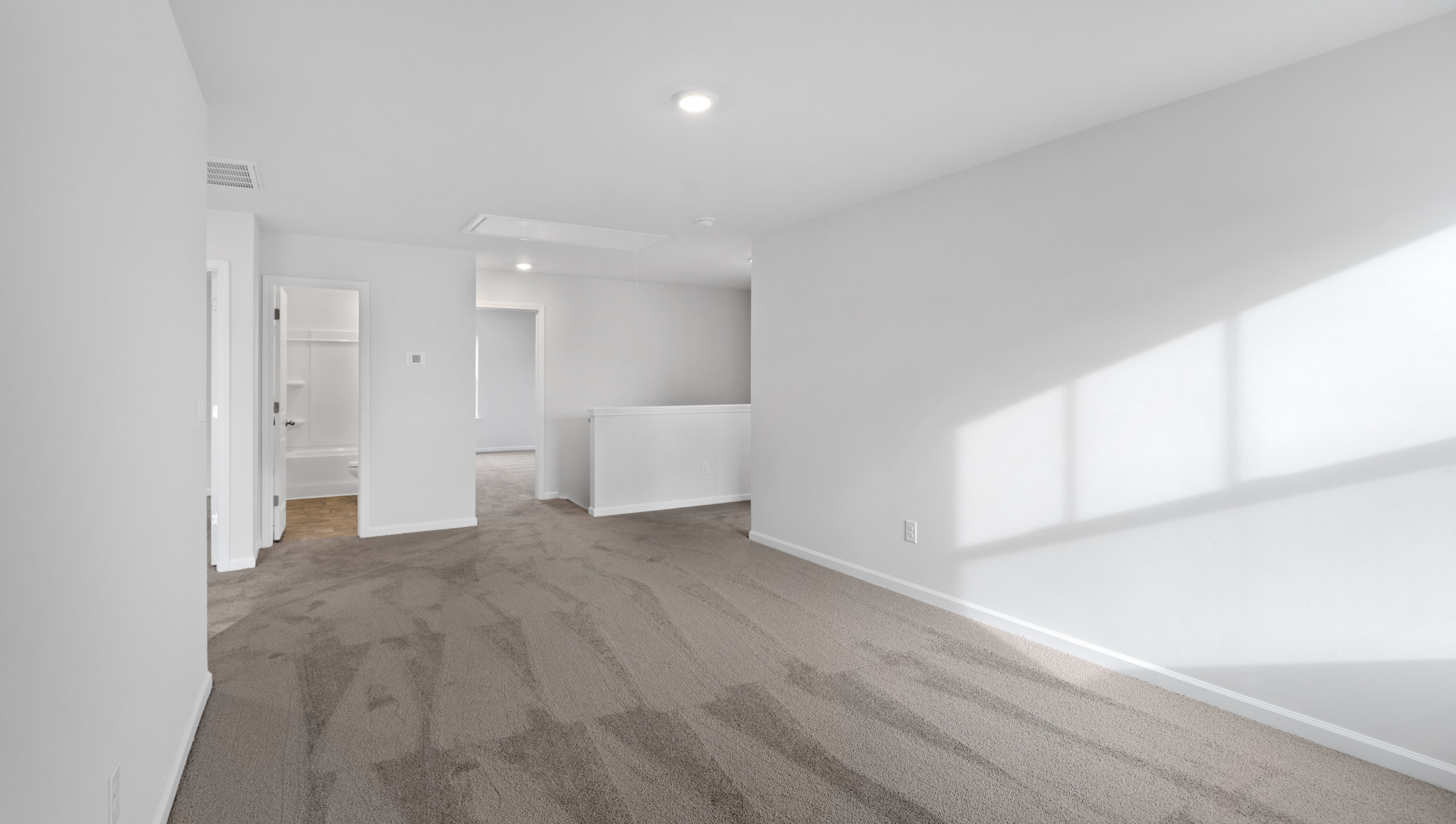 Loft area with carpet.