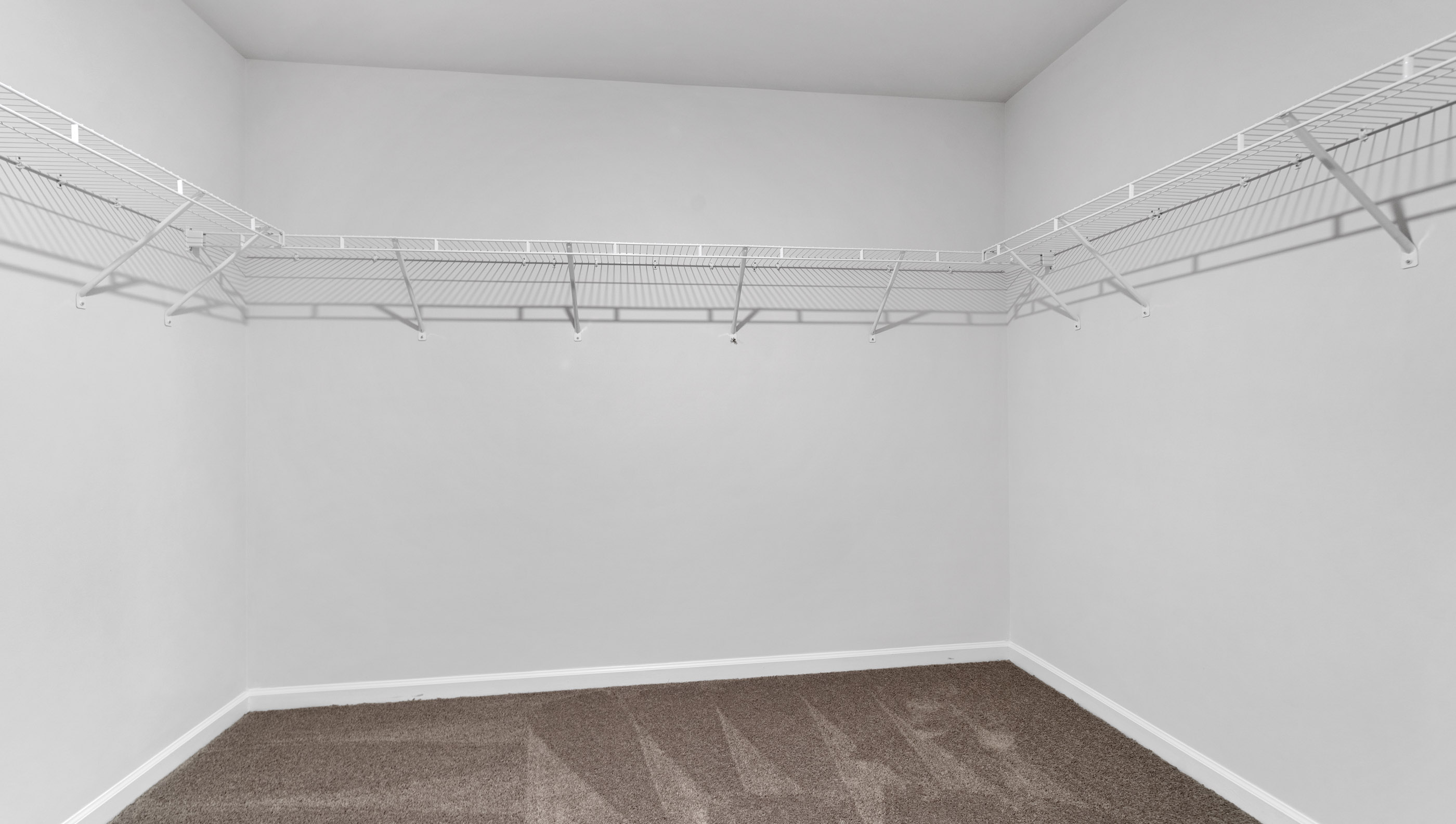 Closet with hanging storage racks.