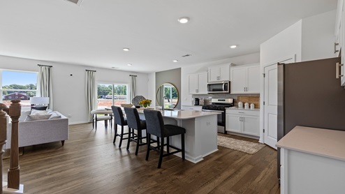 Kitchen with island and cabinets.