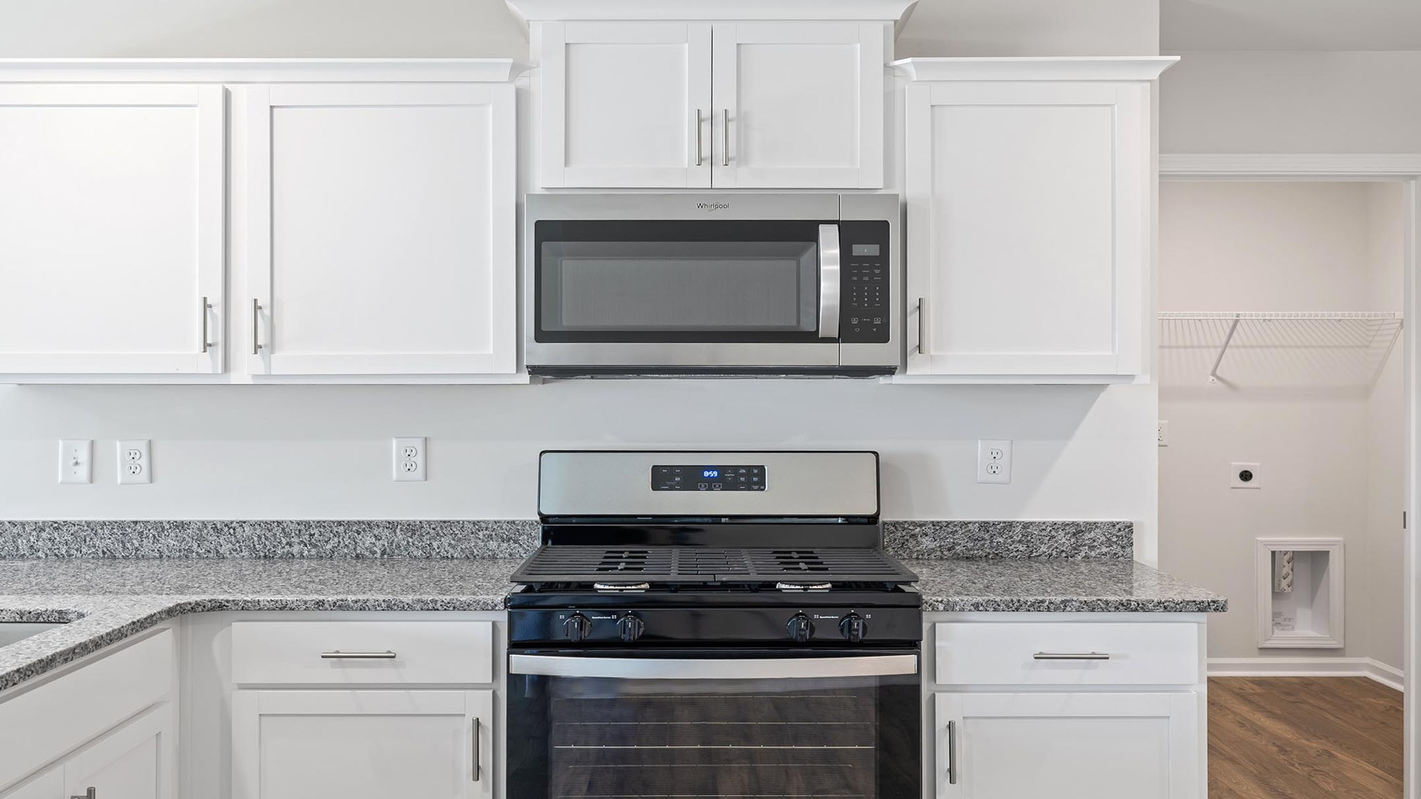 Kitchen with cabinets and windows.