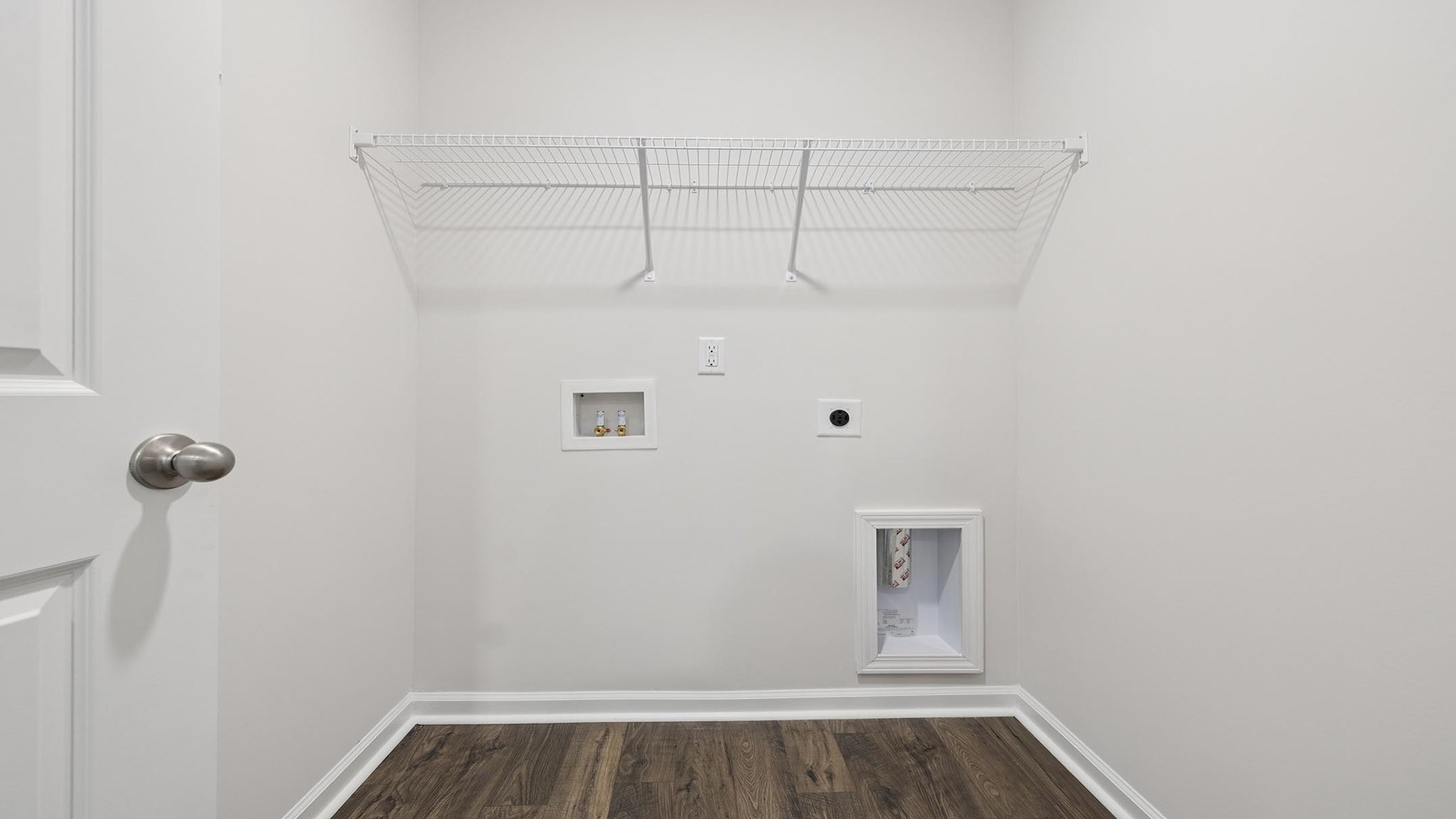 Laundry room with shelf.