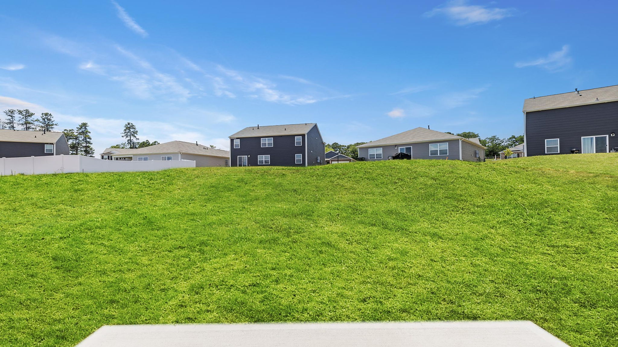 Back exterior with large backyard.