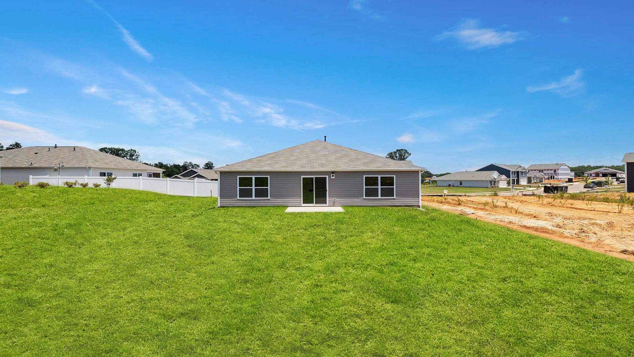 Back exterior with large backyard.