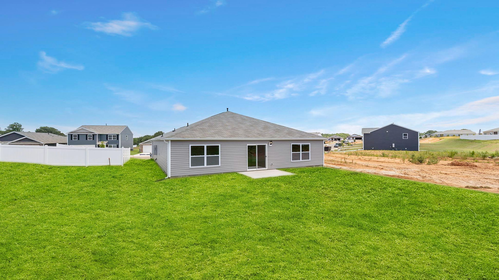 Back exterior with large backyard.