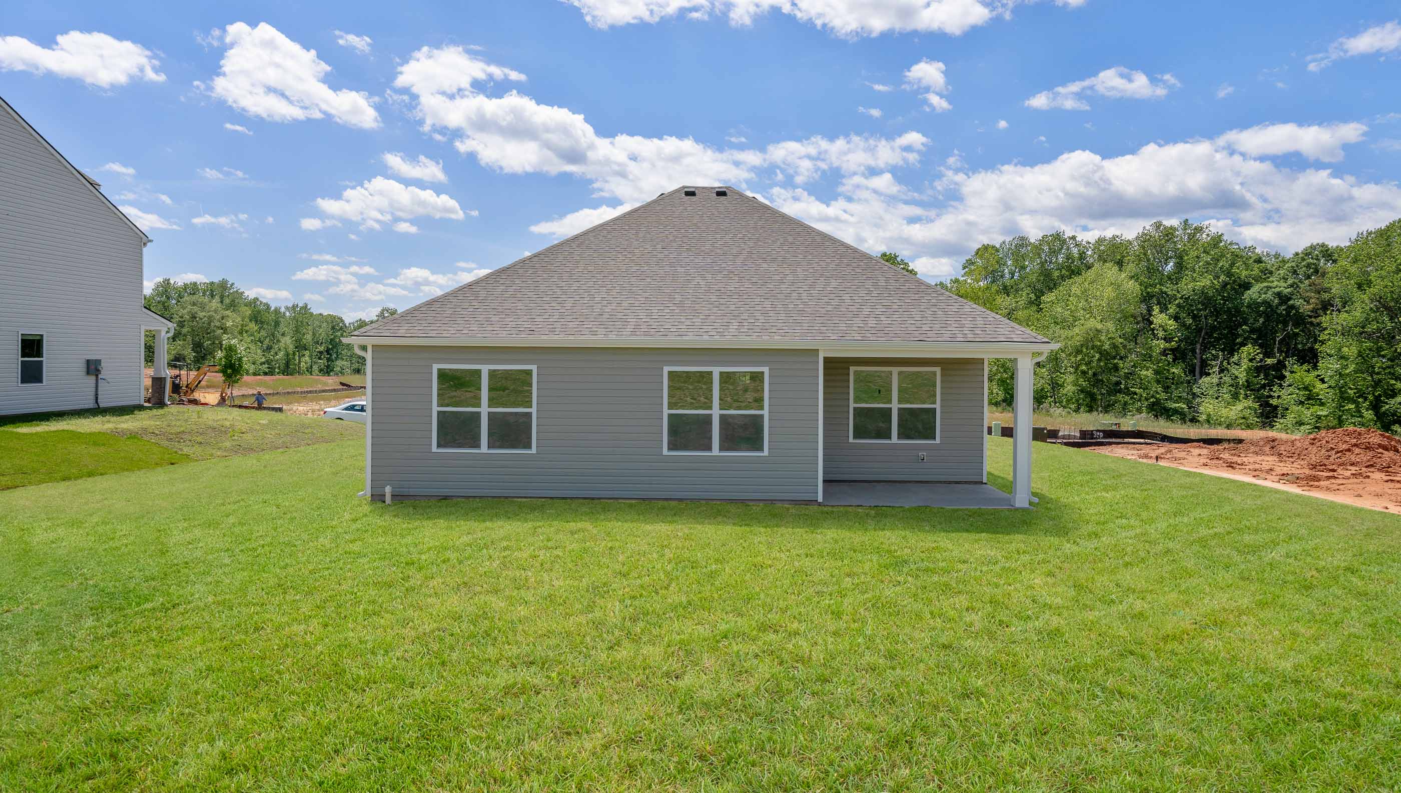 Back exterior view of the Aria with covered porch.