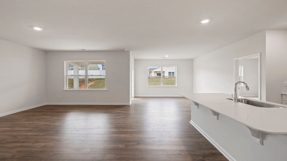 Kitchen open to the combination family and dining areas.