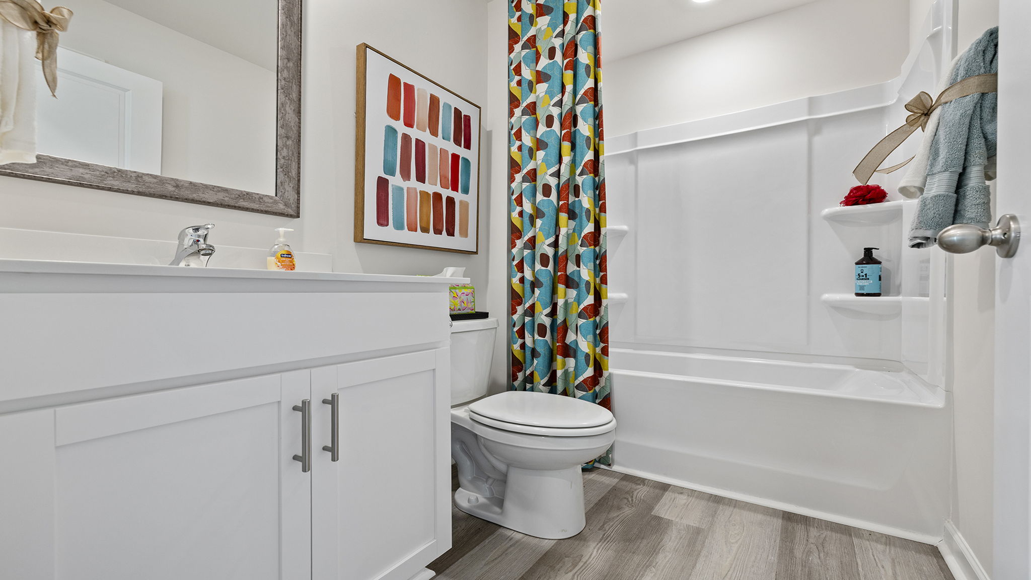Bathroom with vanity sinks.