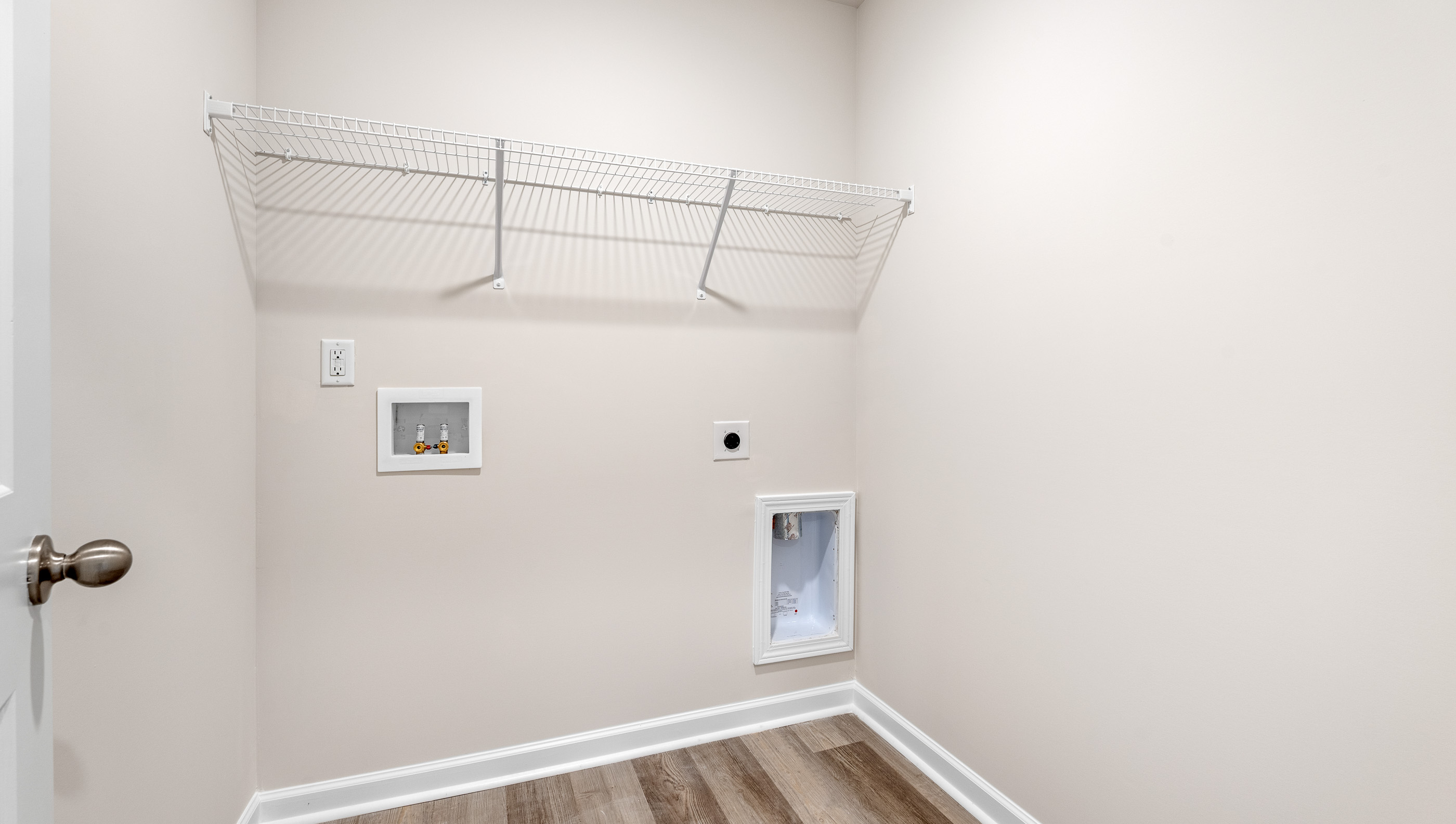 Laundry room with shelving.