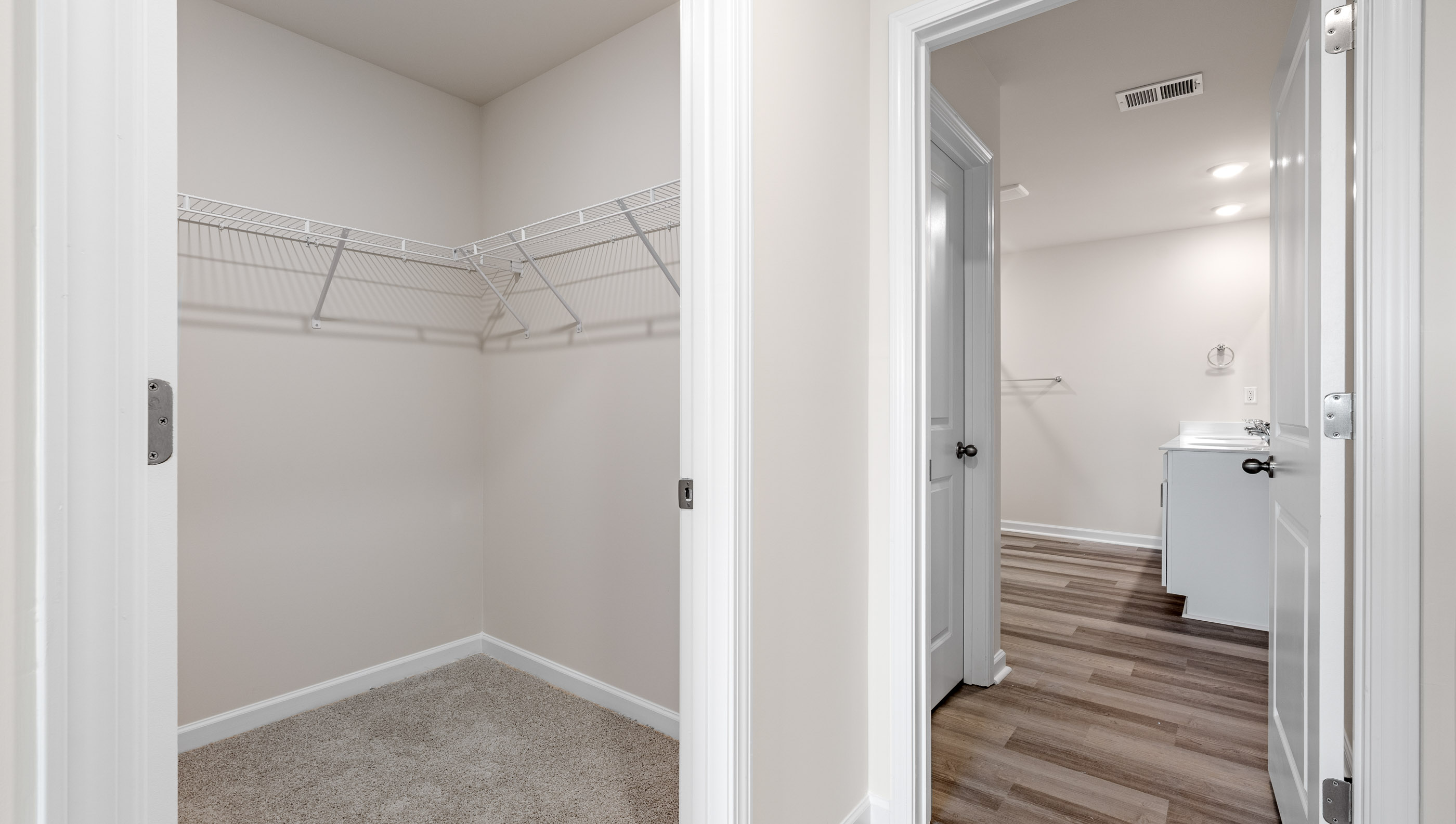 Primary bedroom walk in closet.