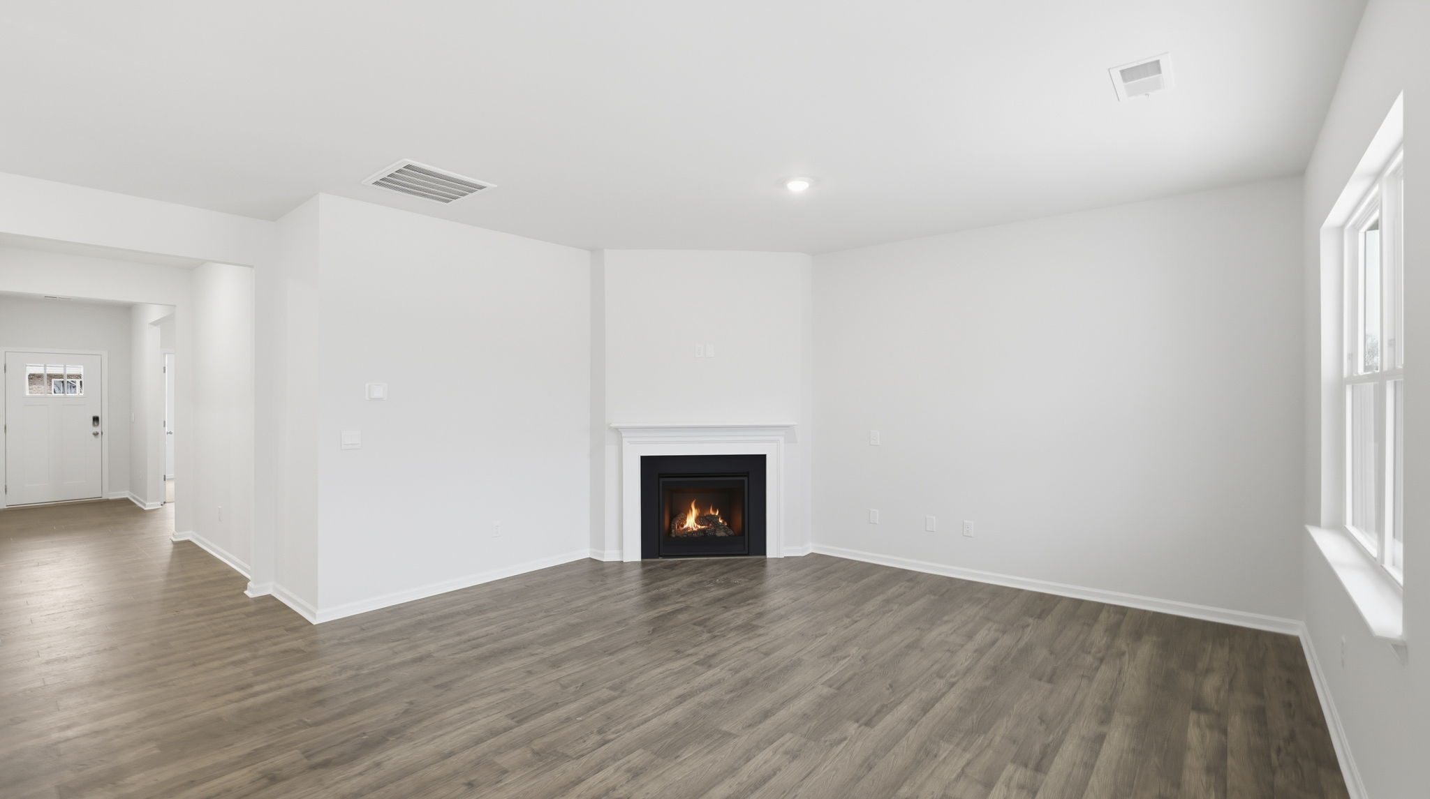 Family room with gas log fireplace.