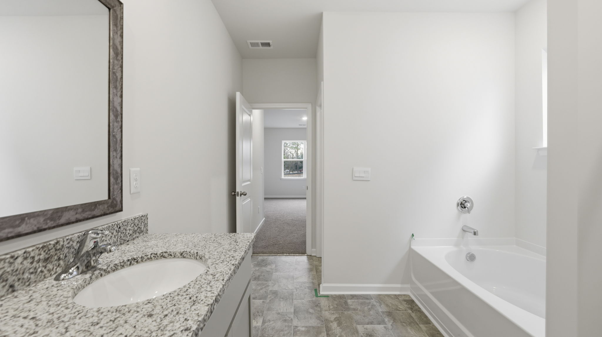 Primary bathroom with dual sink vanity.