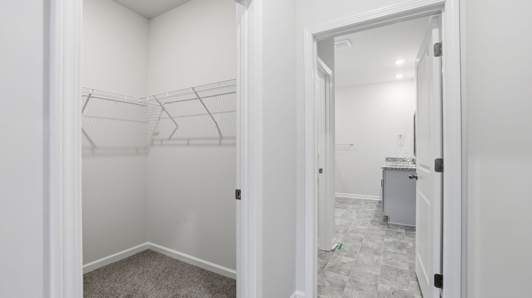 Primary bedroom walk-in closet.