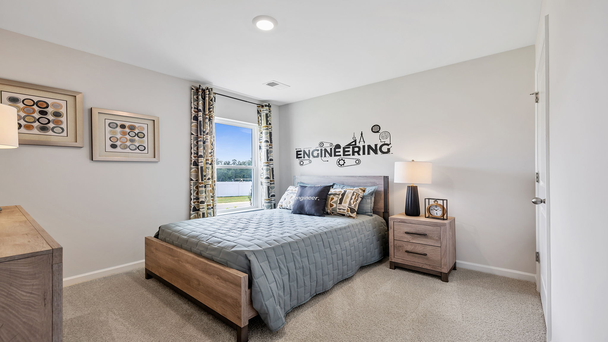 Bedroom with carpet and window.
