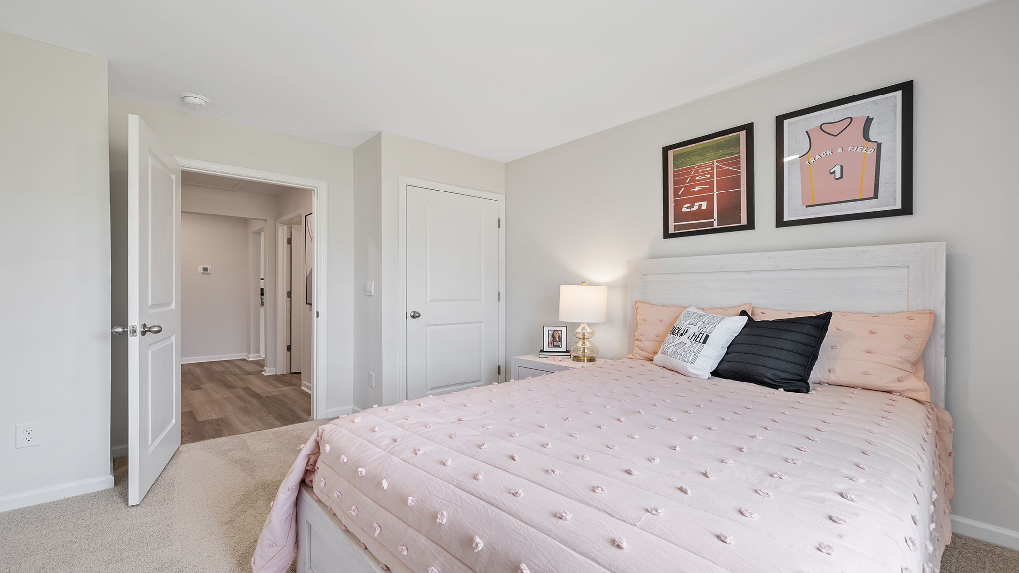 Bedroom with carpet and window.