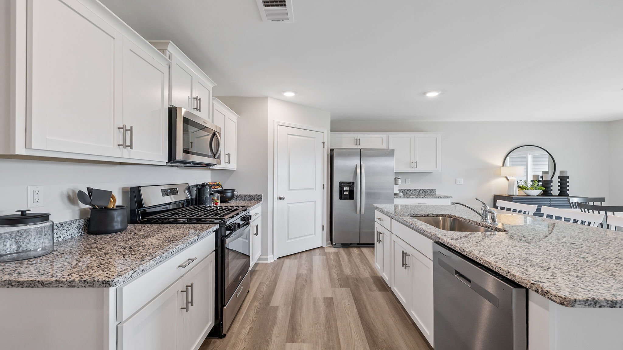 Kitchen and island with granite counter tops.
