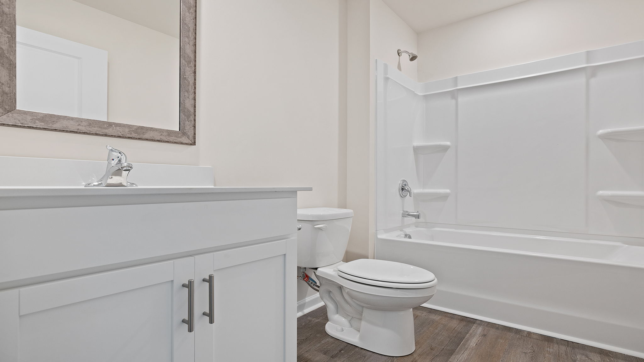 Hall bathroom with vanity and tub.