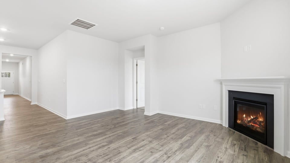 View of family room and hallway to the entrance.