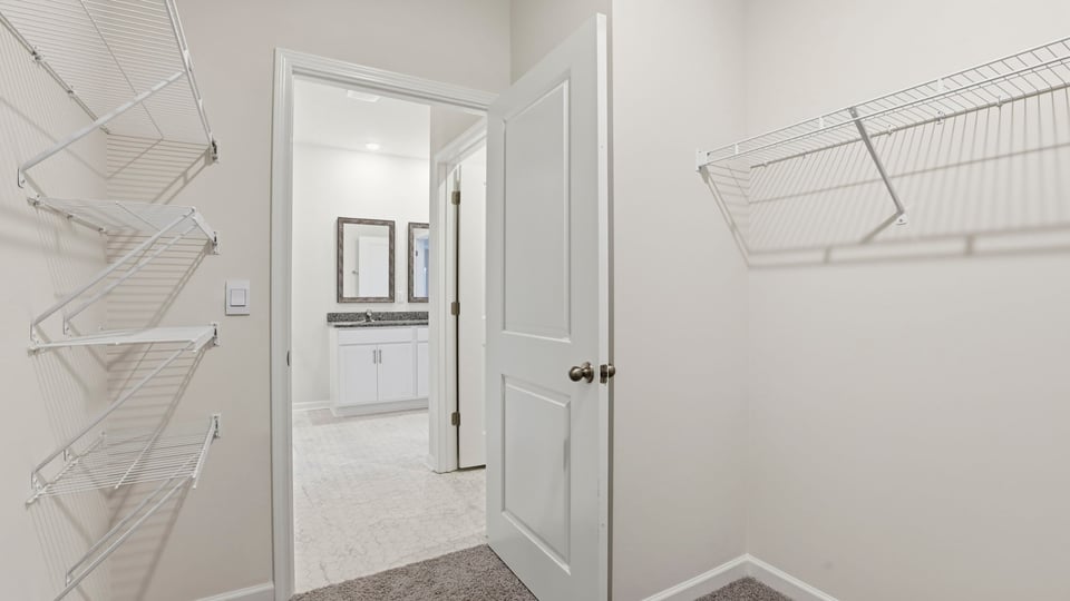 Primary bedroom walk-in closet.