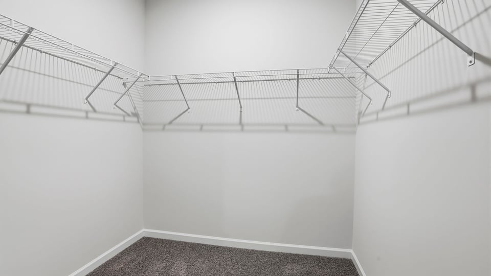 Primary bedroom walk-in closet.