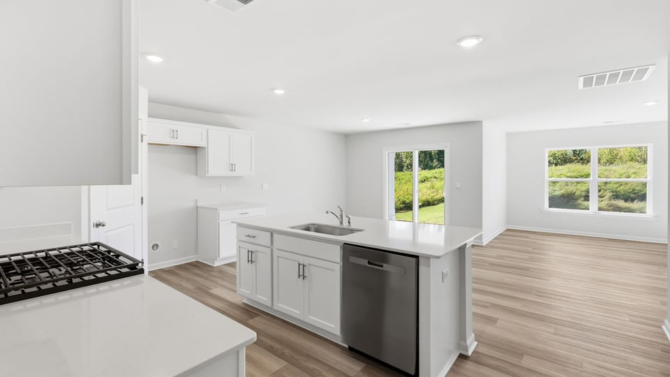 Kitchen with island and cabinets.